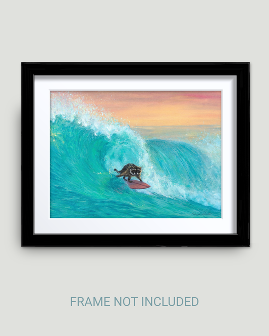 Framed wall art showing a stylized surfer raccoon a large turquoise wave under a pink and orange sky, displayed against a light gray wall with the text 'FRAME NOT INCLUDED' below.