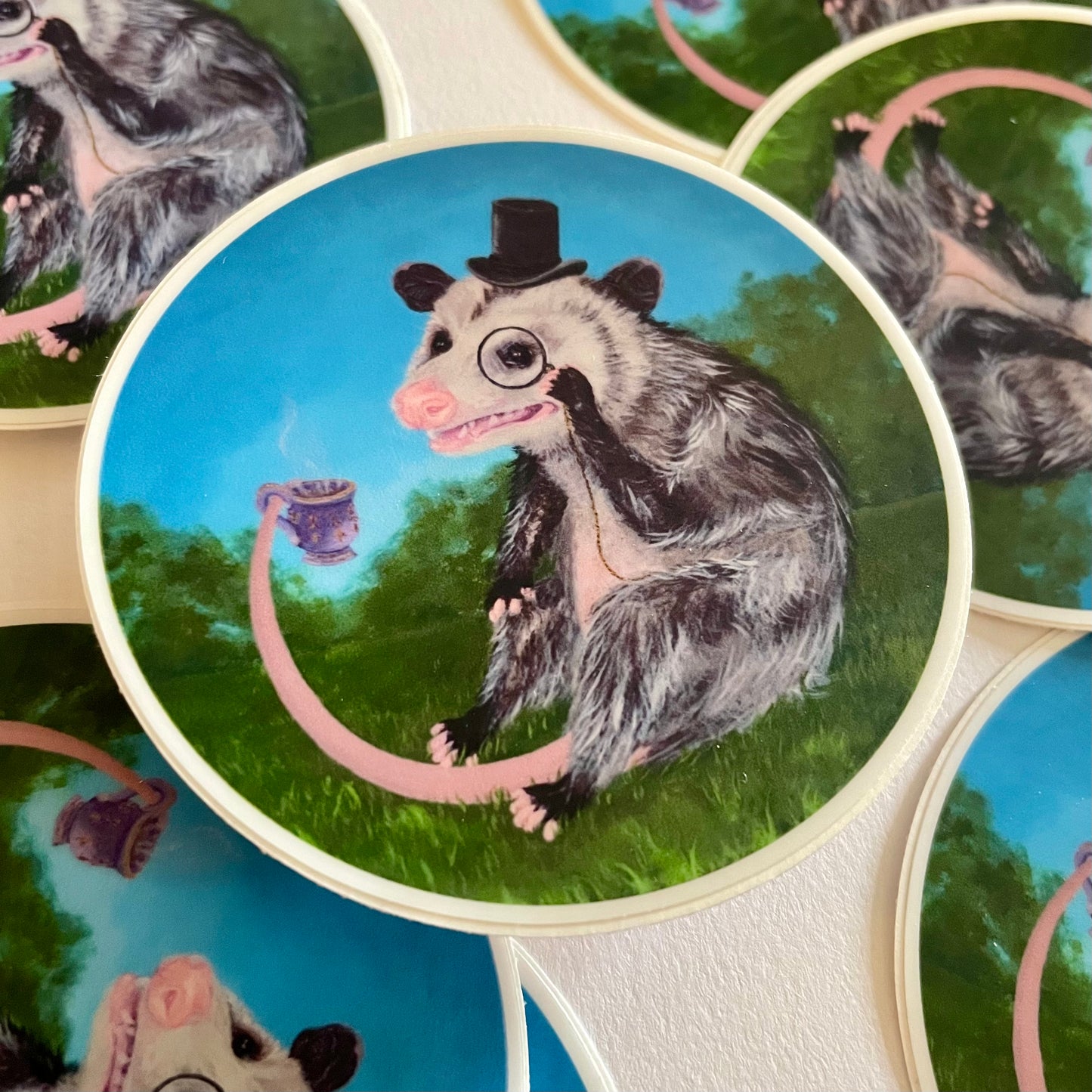 Sticker of an opossum wearing a top hat.